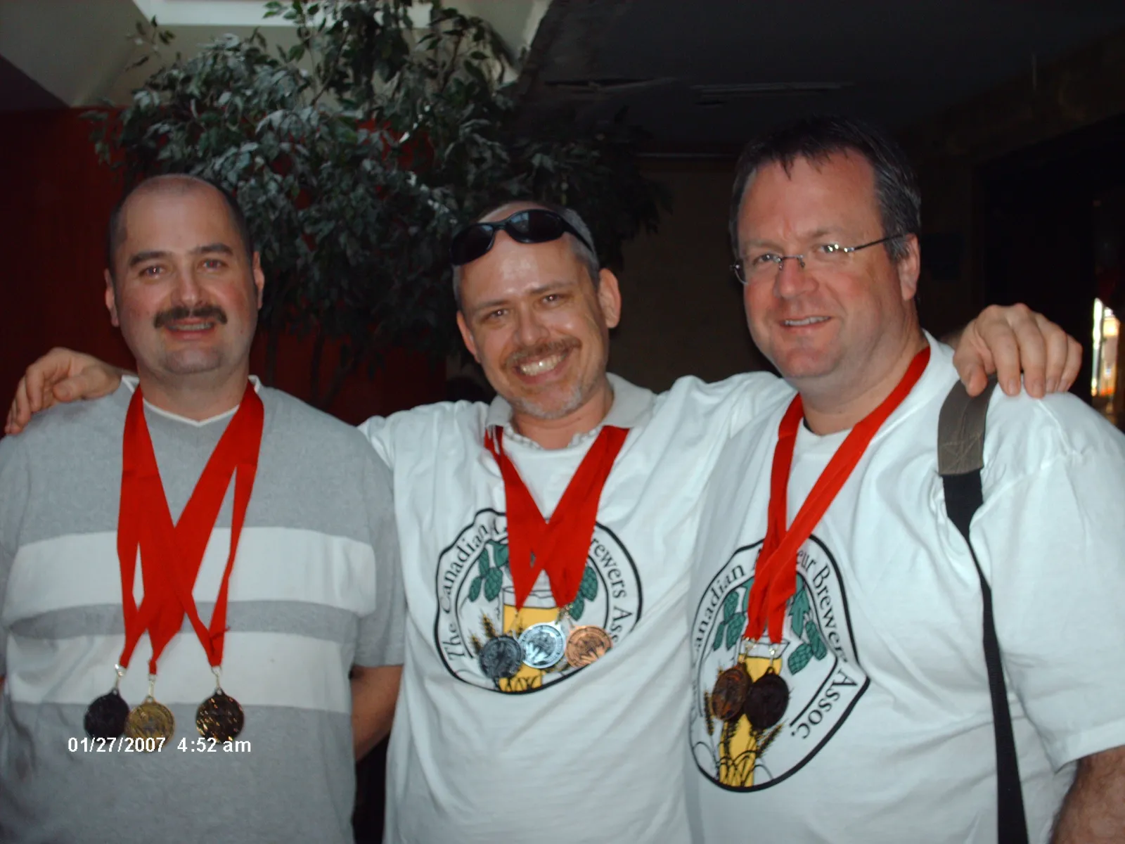 BeerShack members wearing homebrew competition medals at a Canadian brewing awards ceremony