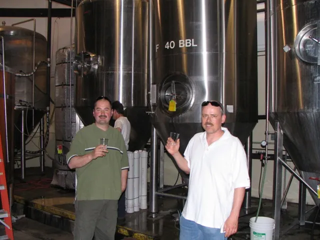 BeerShack brewers Ed Koren and Louis De Bourbon at the brewery with fermentation tanks in Ontario